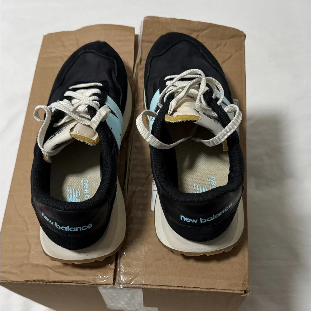 New Balance Black Sneakers with Light Blue 'N' Accent